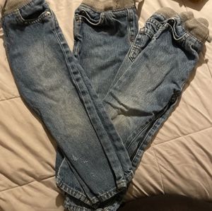 Three pairs of the same jeans